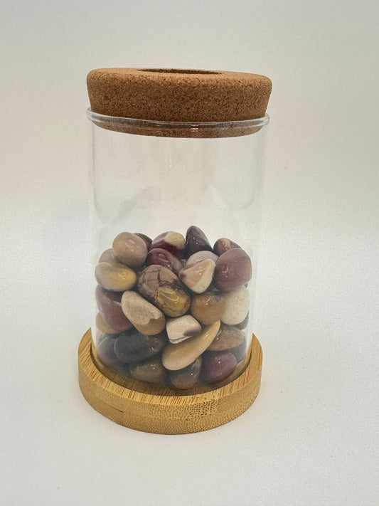 Mookaite jasper propagation station with glass vase, cork ring, and bamboo coaster