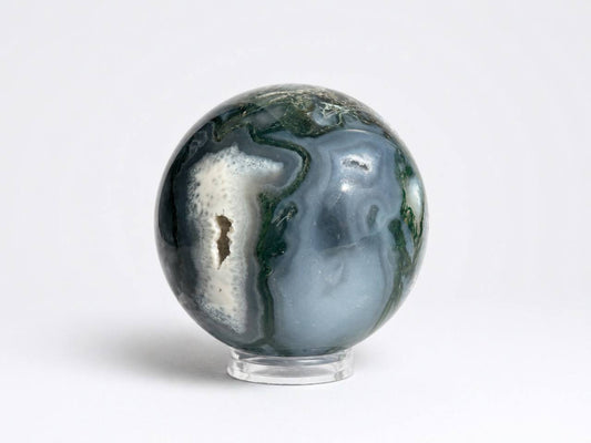 Moss agate sphere showing sparkling druzy quartz cavity