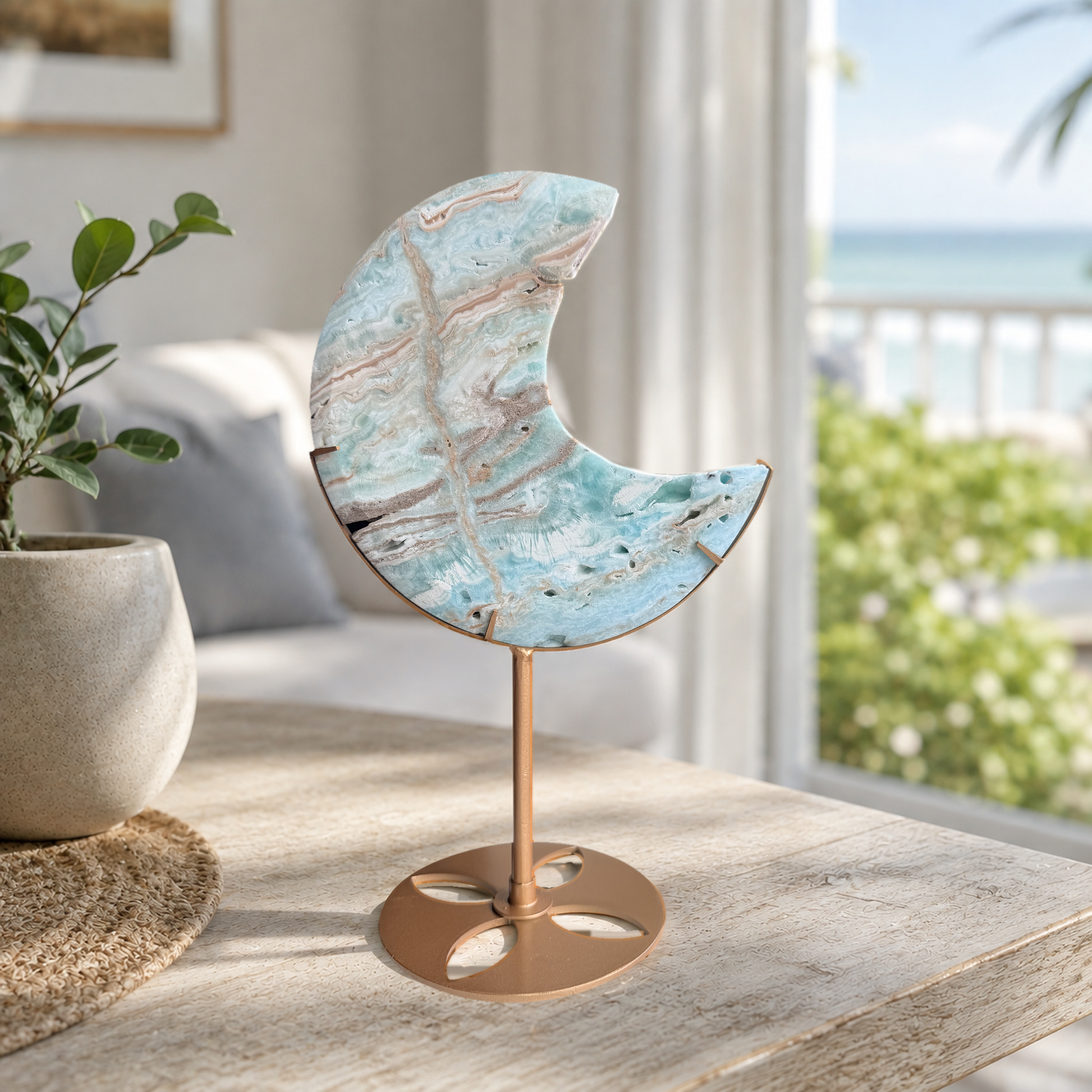 Caribbean calcite crescent moon on a stand in a coastal room