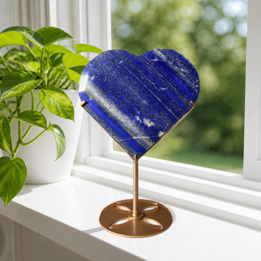Lapis lazuli heart on gold stand, lifestyle