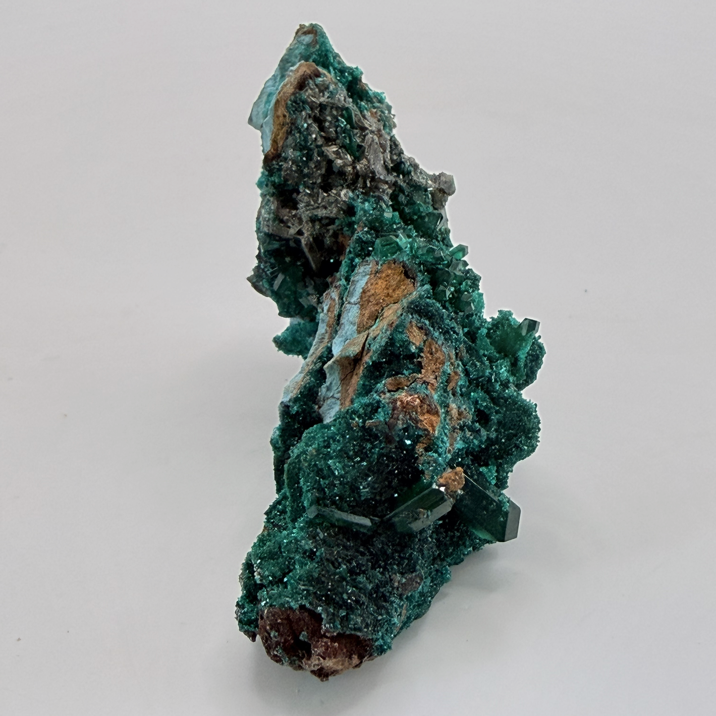 Dioptase specimen with silvery blades