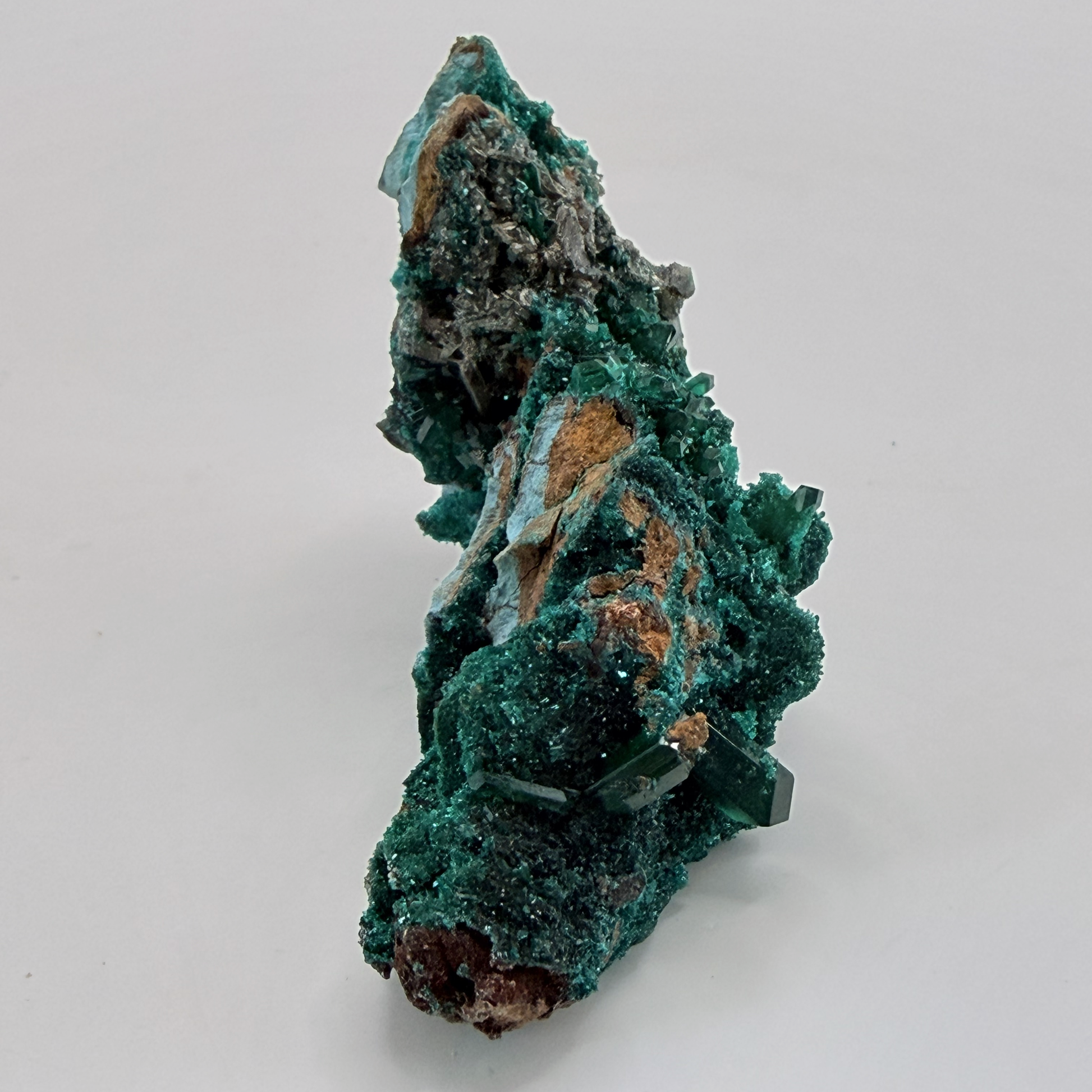 Dioptase specimen with silvery blades
