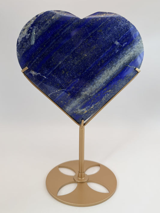Lapis lazuli heart on gold stand, on stand