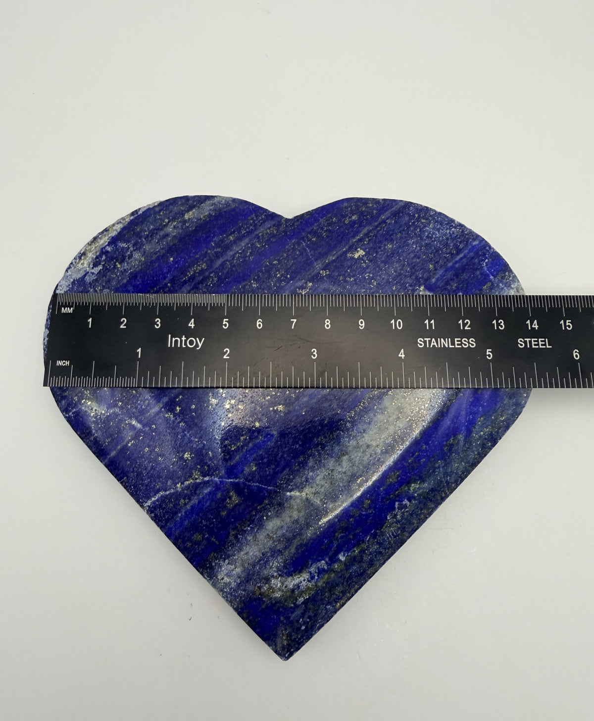 Lapis lazuli heart on gold stand, ruler width