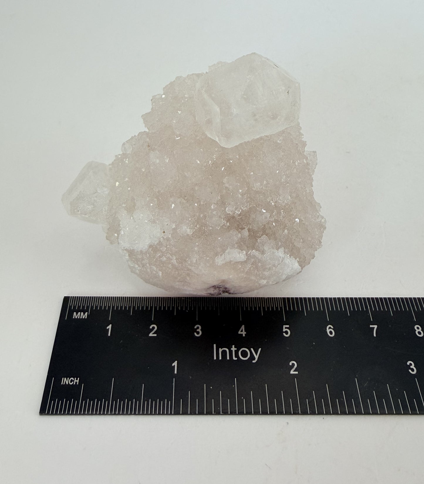 White apophyllite cluster with clear terminated crystal
