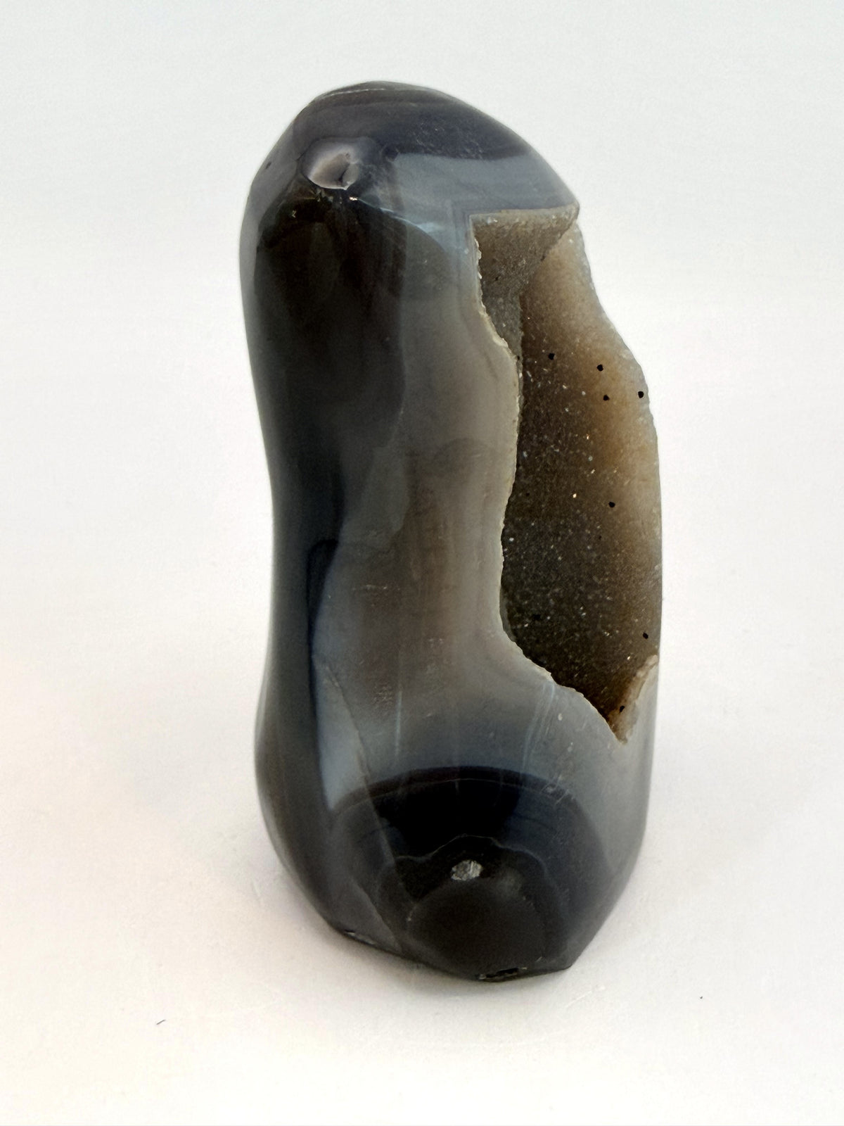 Banded agate geode with druzy quartz cave