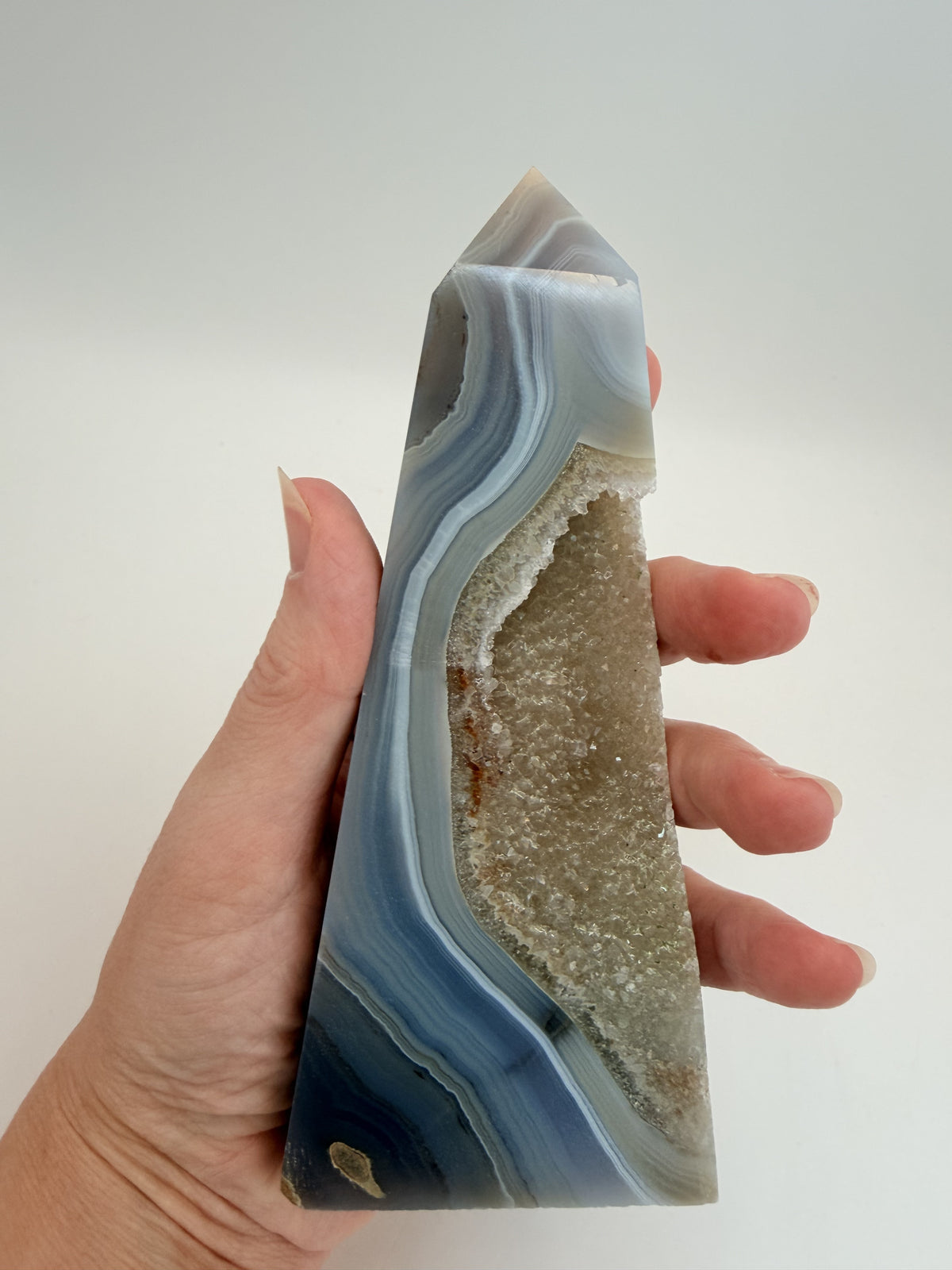 Blue banded agate obelisk with druzy quartz pocket