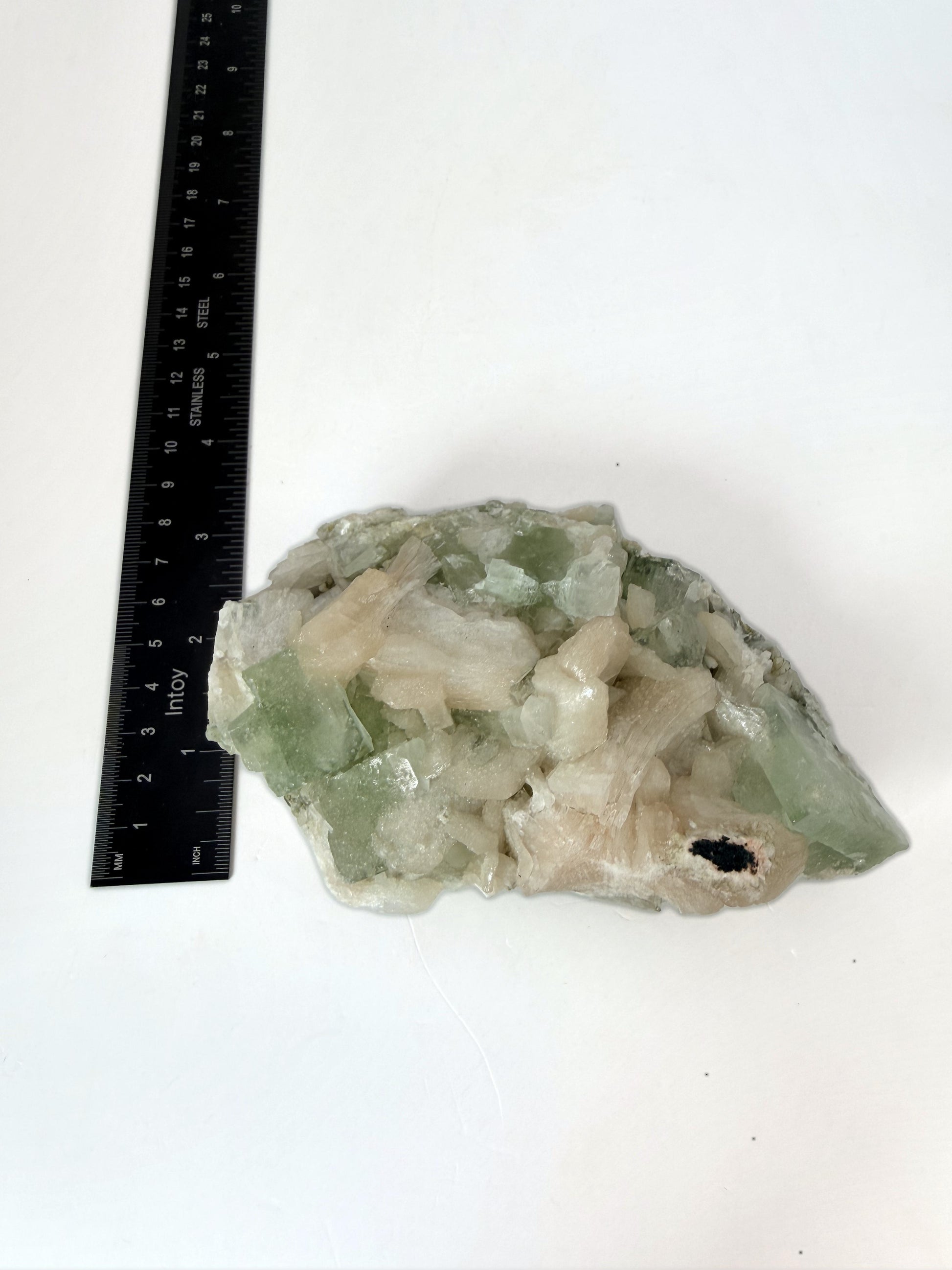 Green apophyllite with peach stilbite, size reference