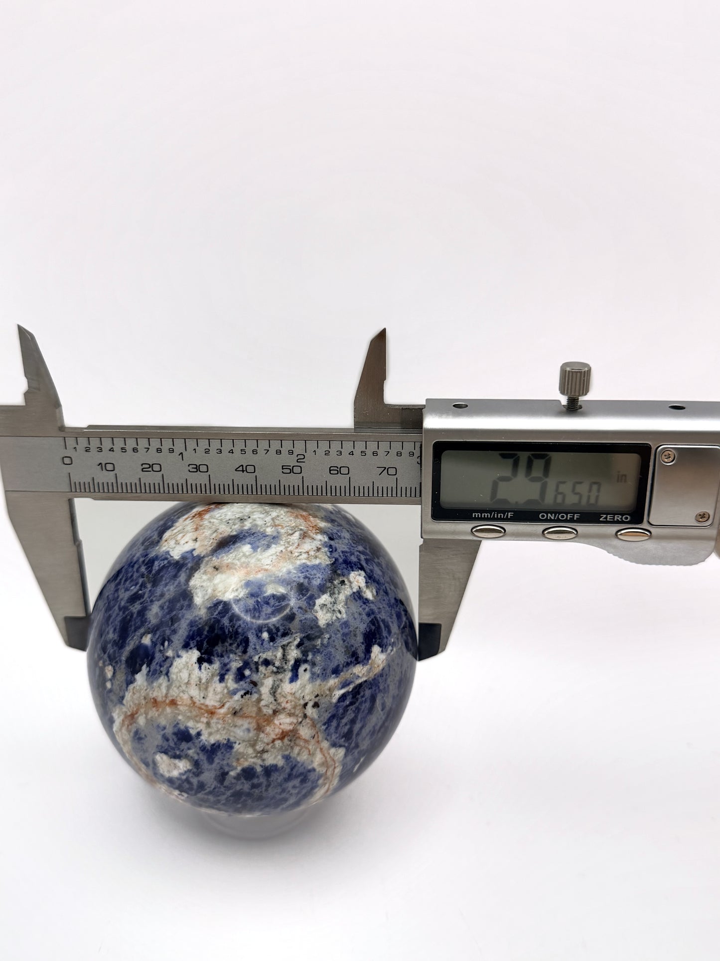 Sunset Sodalite sphere measured at 2.965 inches
