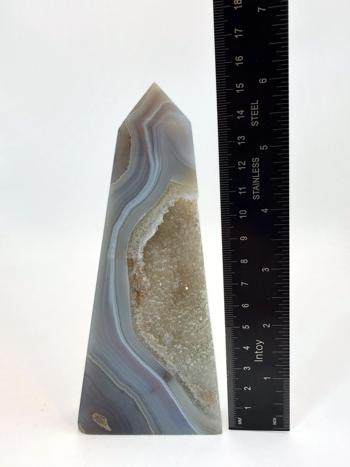 Blue banded agate obelisk with druzy quartz pocket