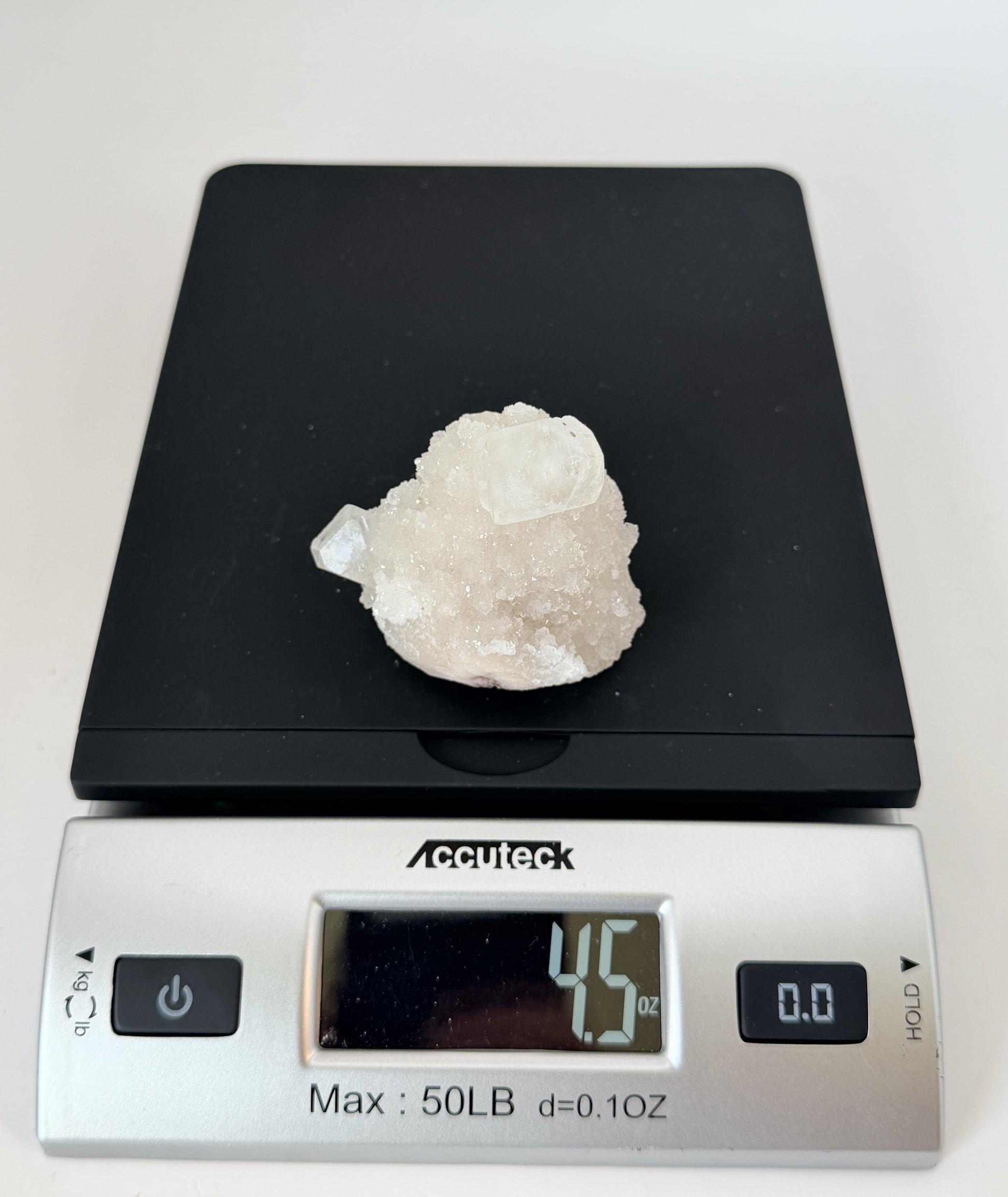 White apophyllite cluster with clear terminated crystal