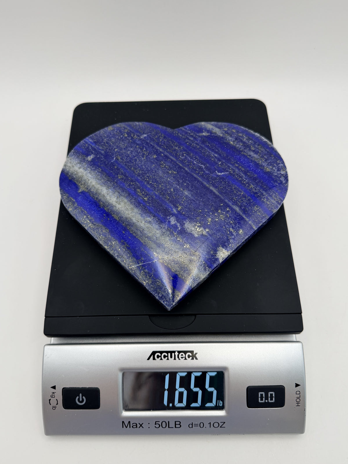 Lapis lazuli heart on gold stand, weight