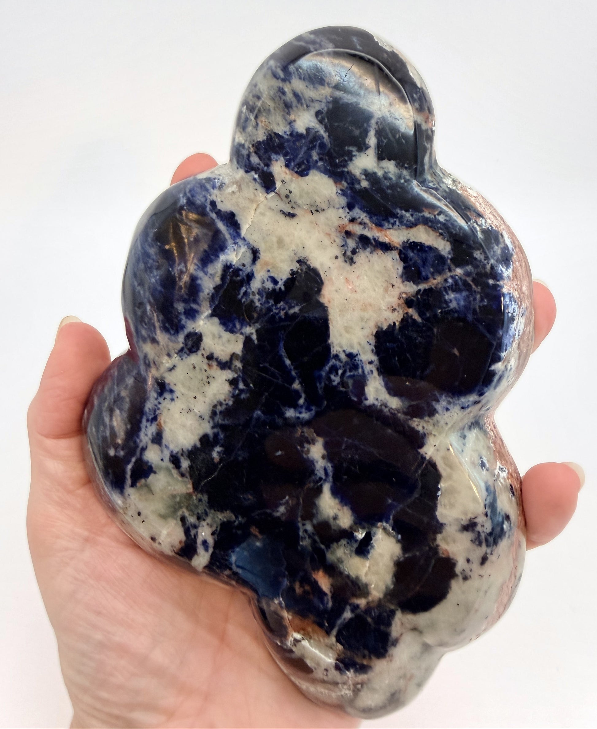 Sunset sodalite cloud dish held in hand for scale