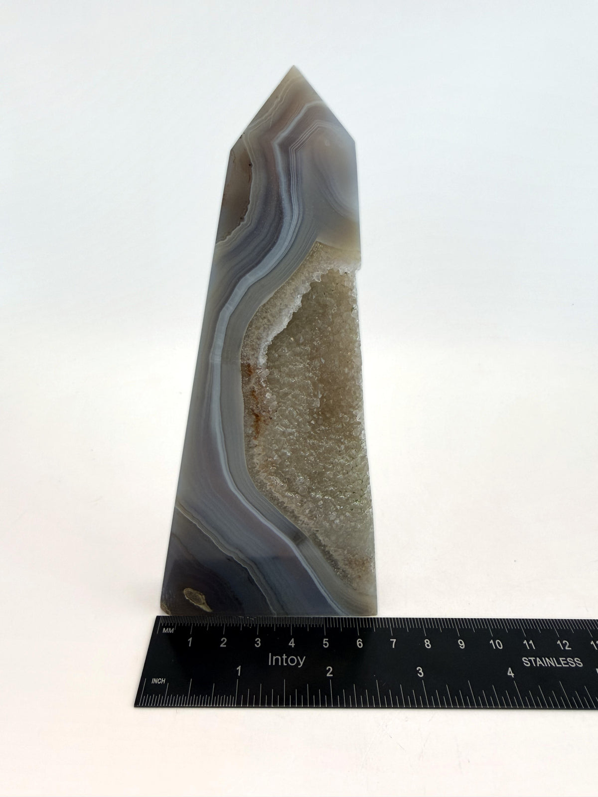 Blue banded agate obelisk with druzy quartz pocket