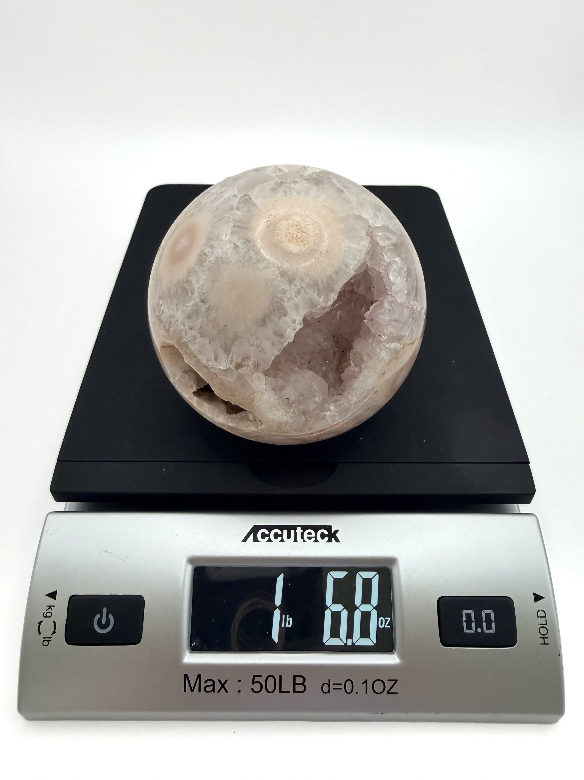Flower agate sphere with druzy geode pocket