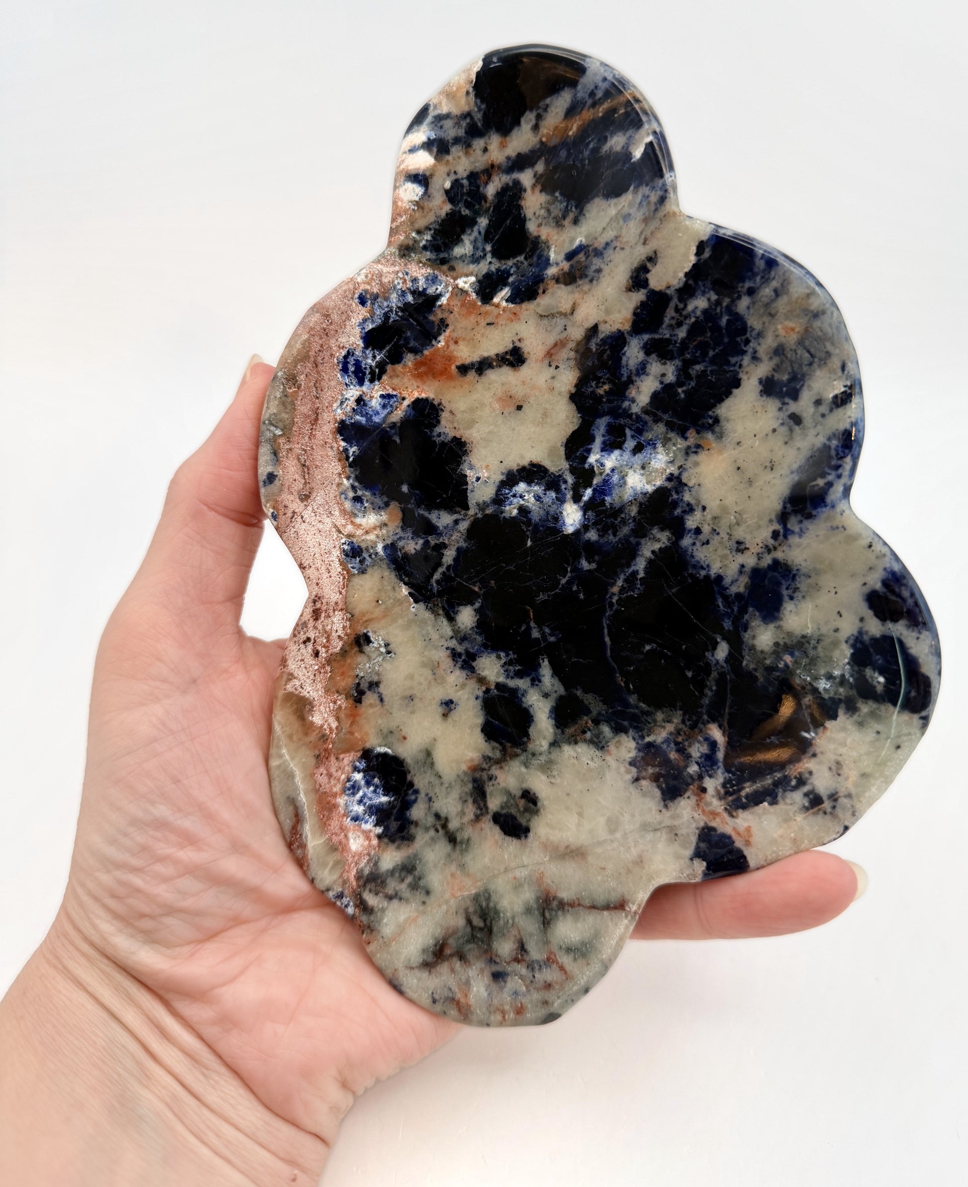 Sunset sodalite cloud dish in hand, front view