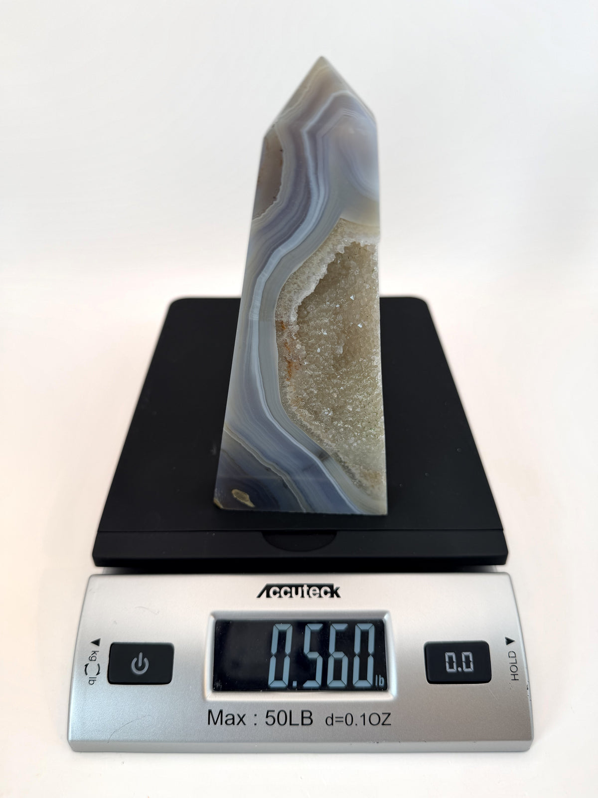 Blue banded agate obelisk with druzy quartz pocket