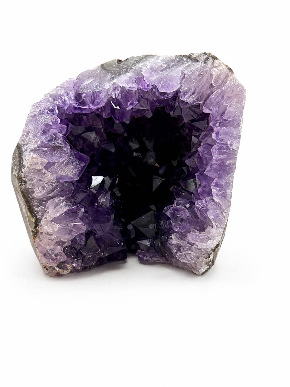 Uruguay Amethyst Geode Cave, front view on white background