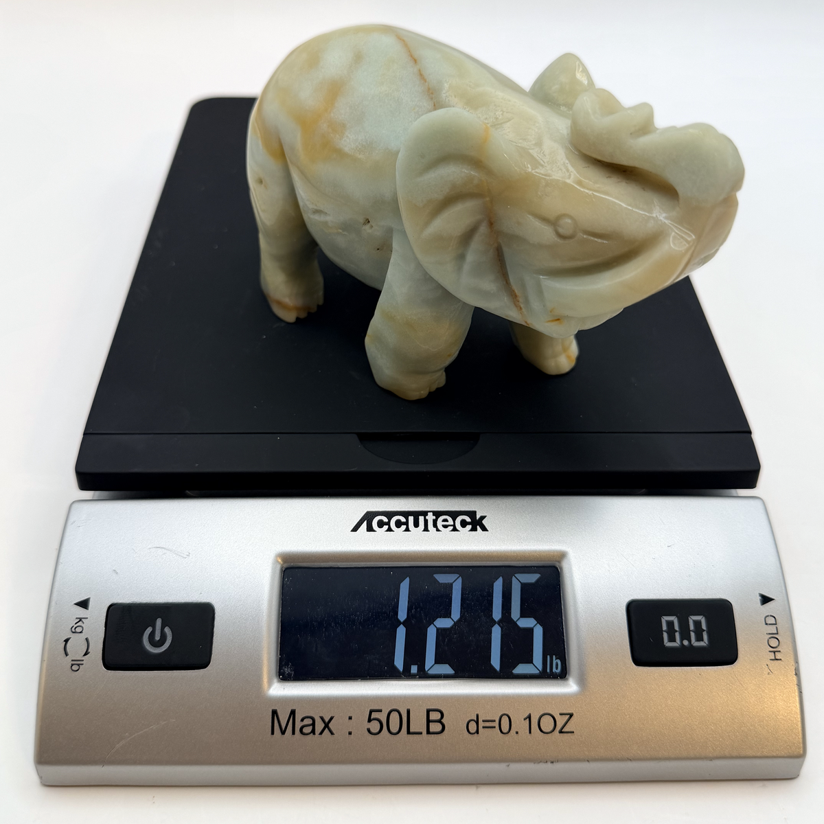 Elephant on a scale reading 1.215 pounds