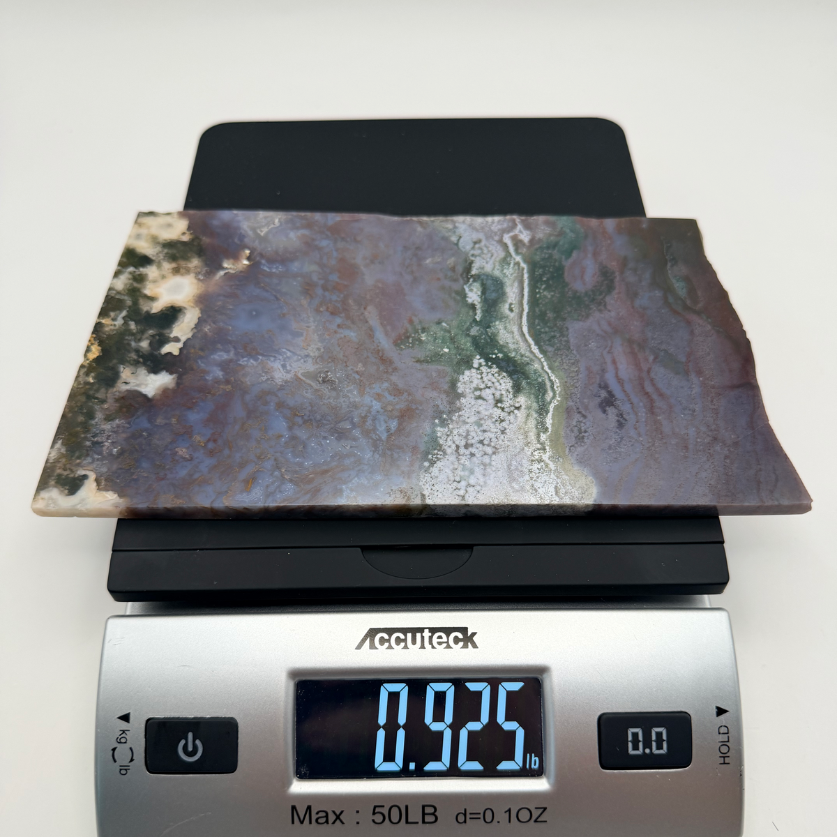 Slab on a scale reading 0.925 pounds