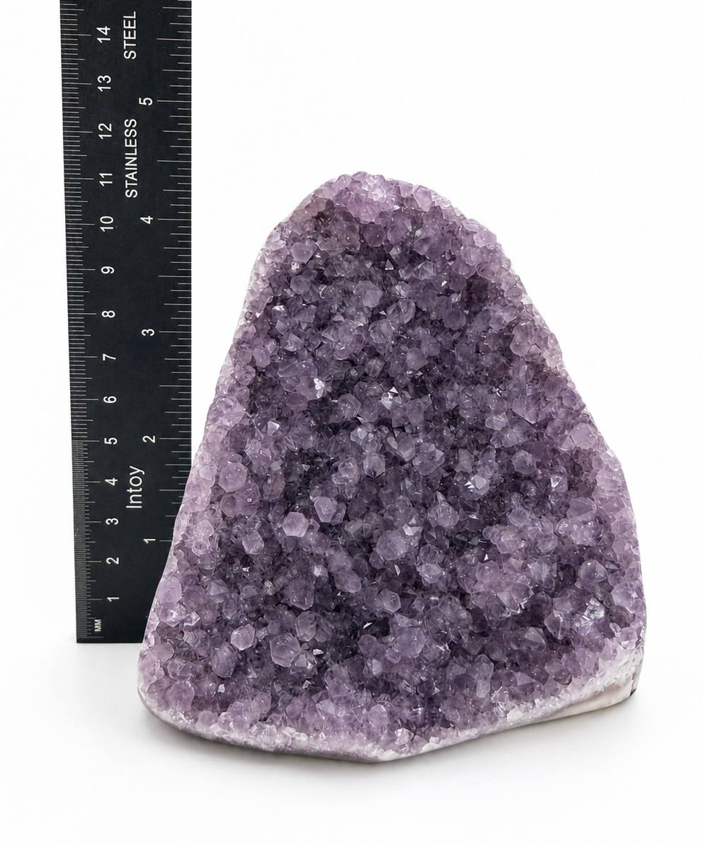 Lavender amethyst cluster with ruler showing height