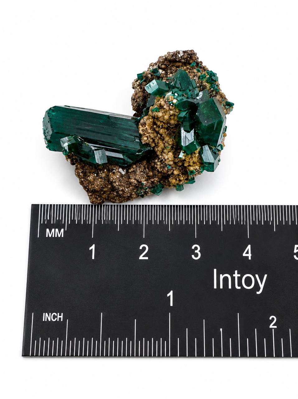 Dioptase crystal blade with ruler front view