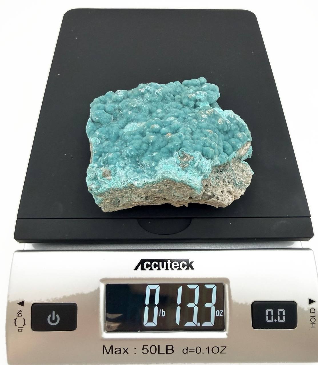 Hemimorphite specimen on scale showing 13.3 oz