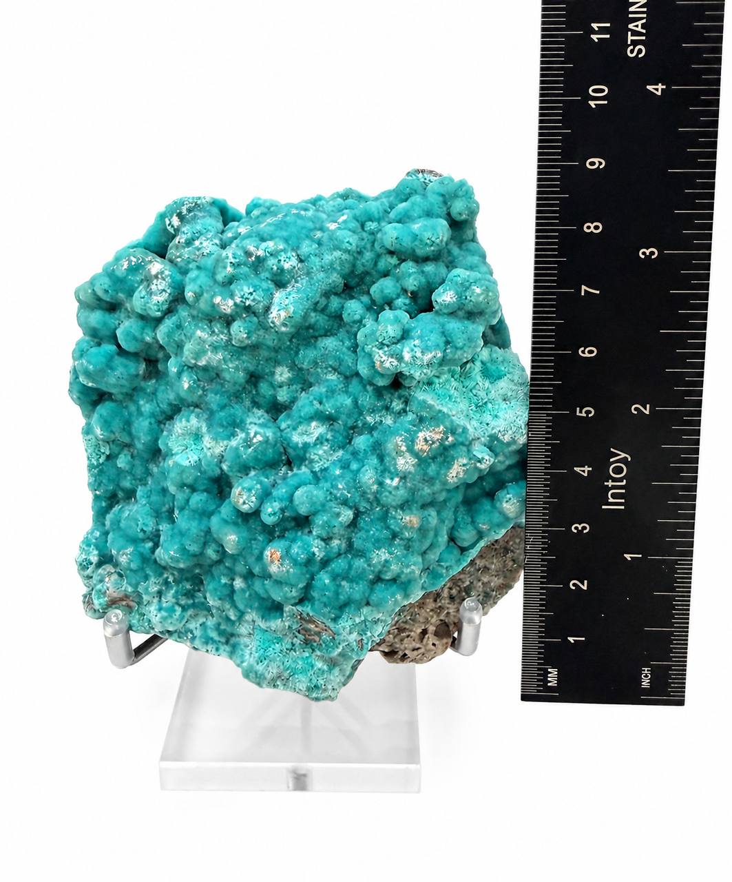 Teal hemimorphite specimen side view with ruler showing height