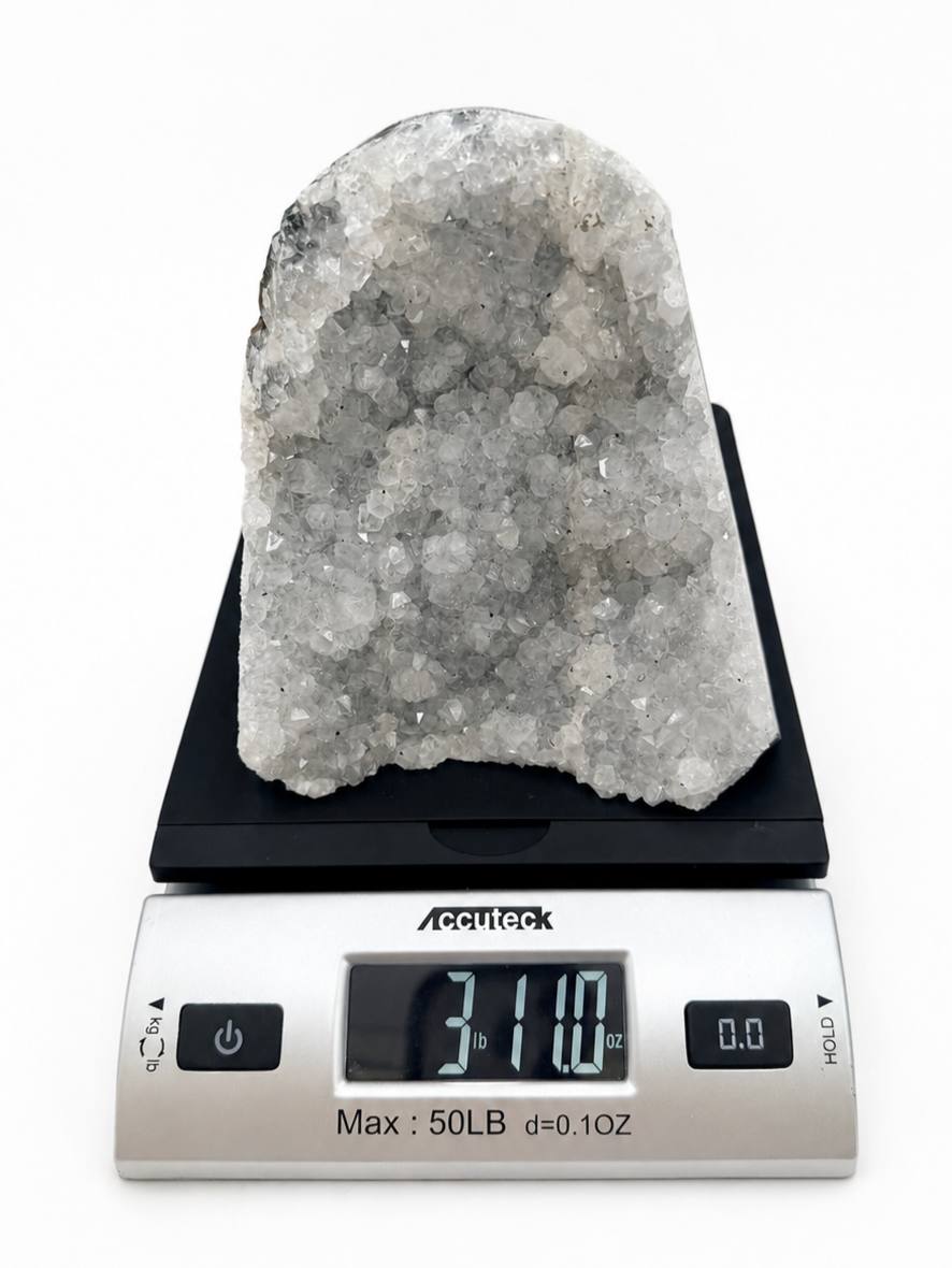 Icy amethyst cluster on scale showing 3 lb 11 oz