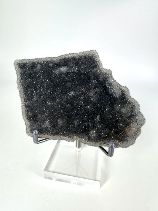 Dark amethyst druzy plate on its acrylic stand
