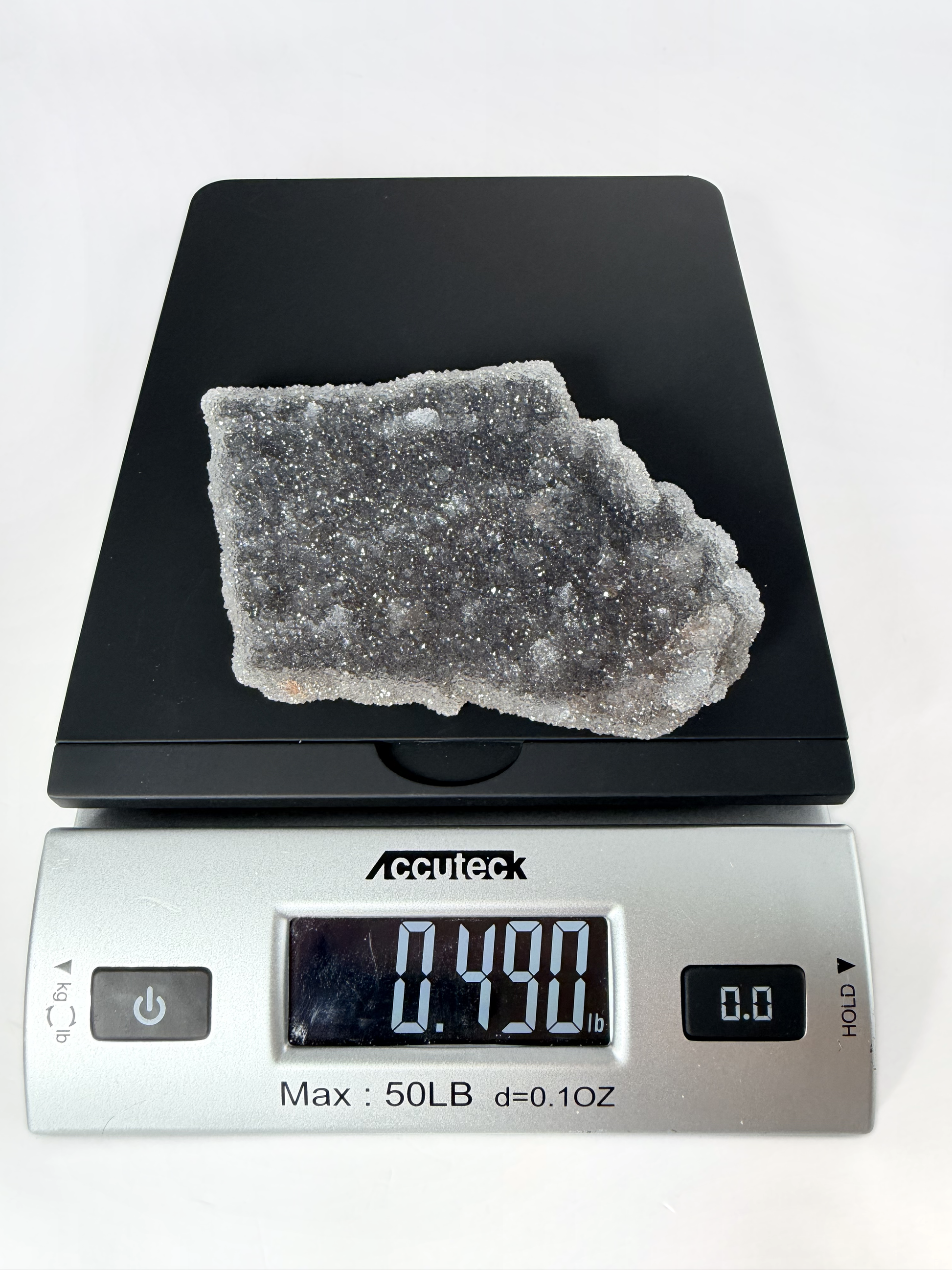 Amethyst druzy plate on a scale, 0.490 lb