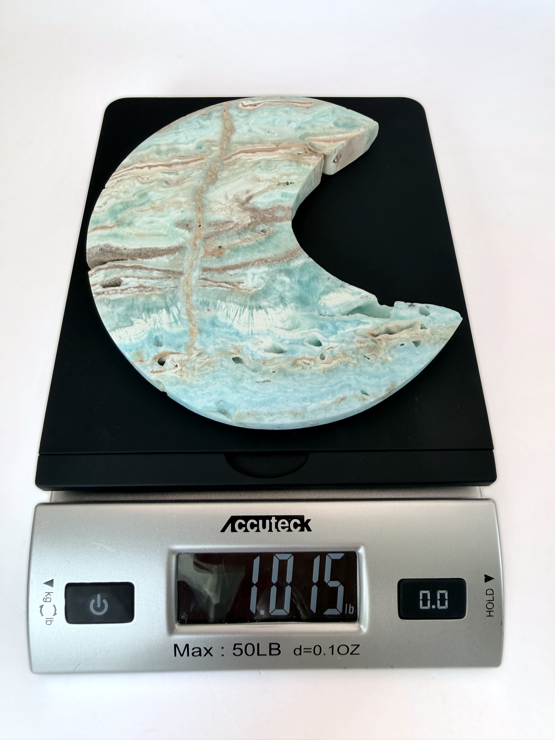Caribbean calcite moon on a scale, 1.015 lb