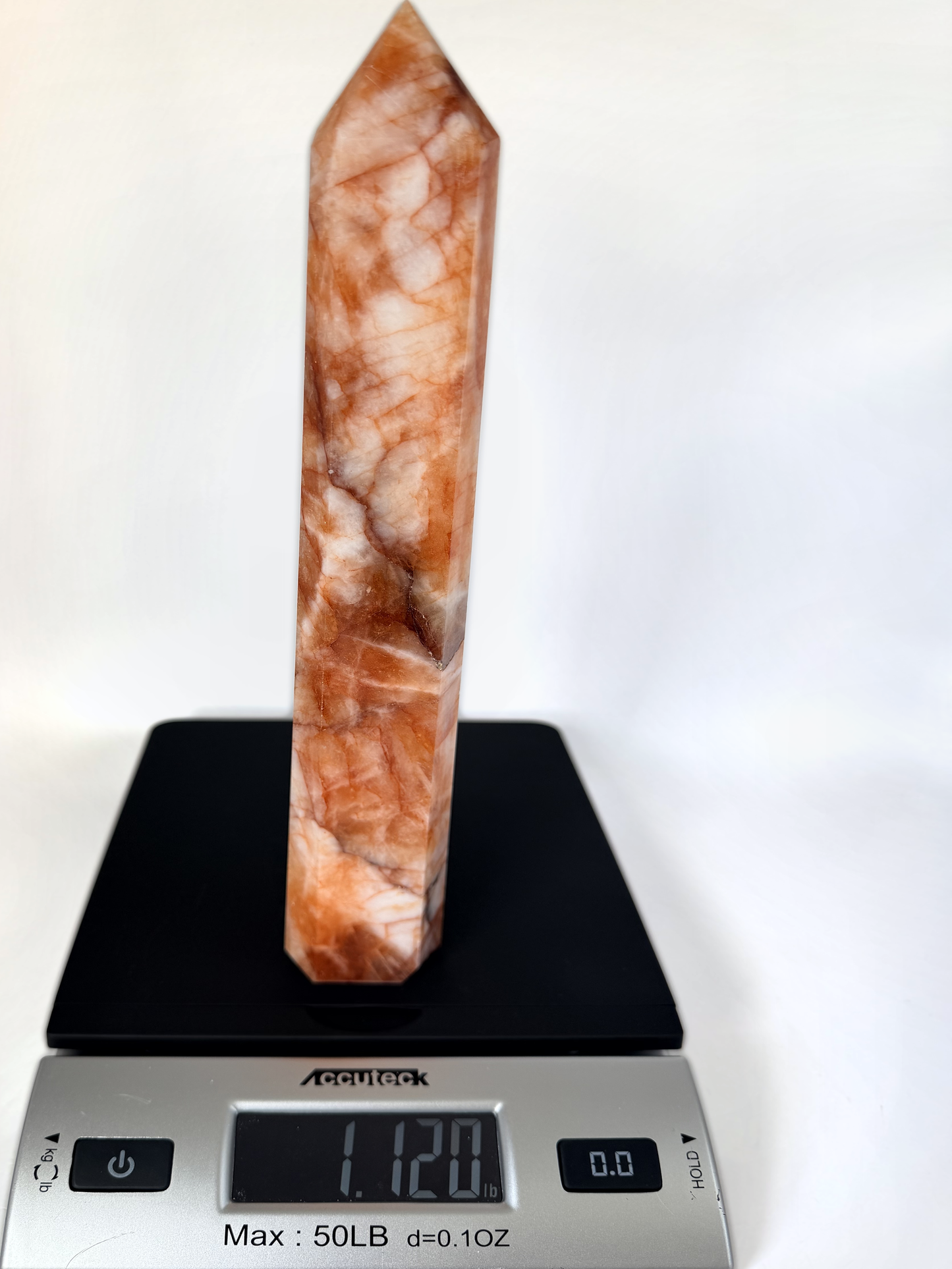 Fire quartz tower on a scale, 1.120 lb
