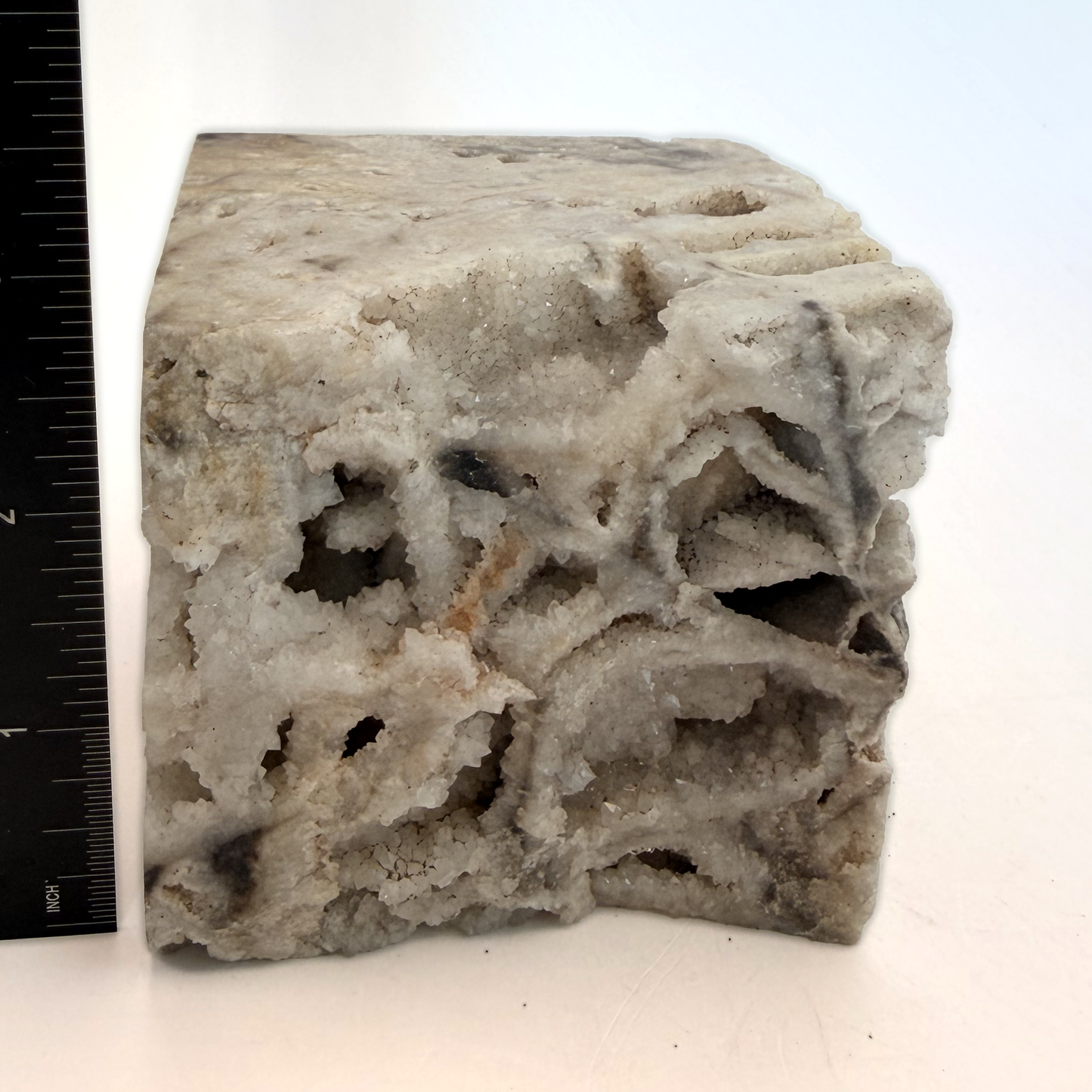 Druzy quartz boxwork specimen with a ruler for scale