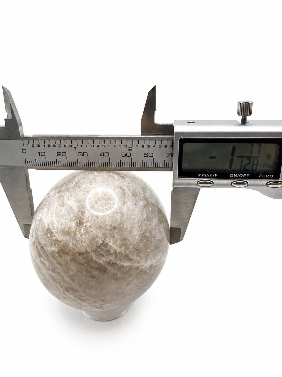 Peach moonstone sphere measured with digital calipers at 1.77 inches