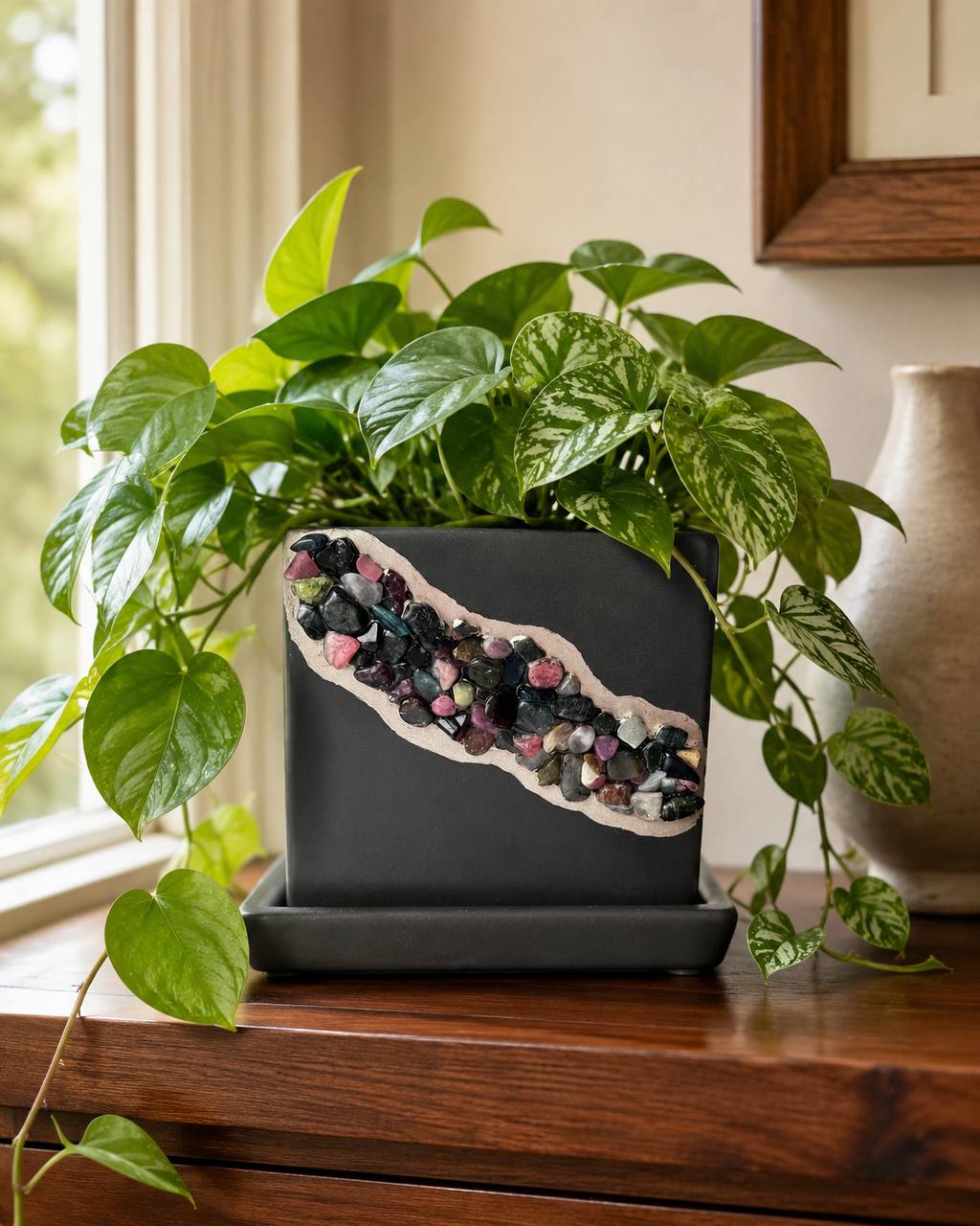 Tourmaline crystal planter lifestyle with pothos plant on wood table