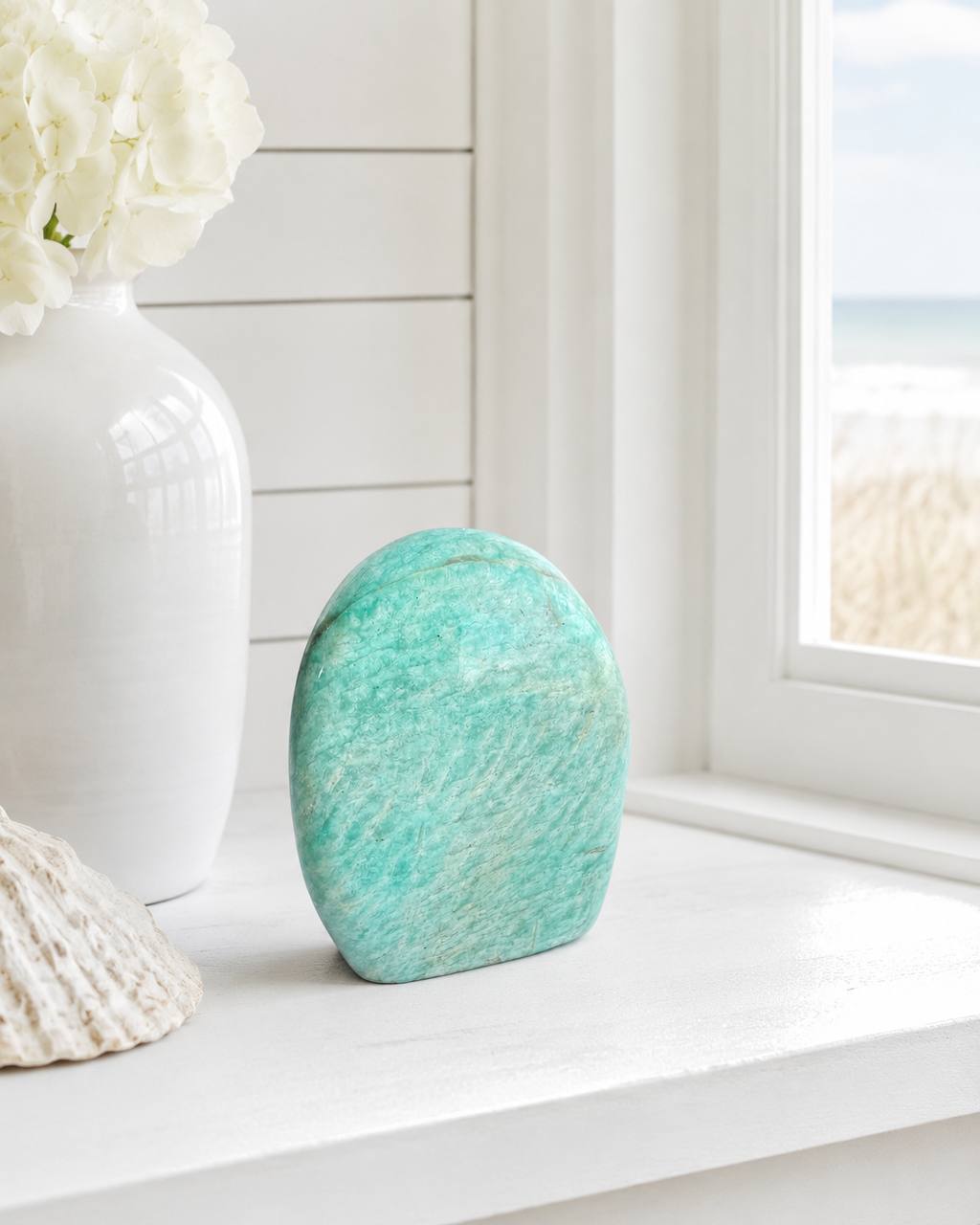 Amazonite freeform lifestyle on windowsill with hydrangeas