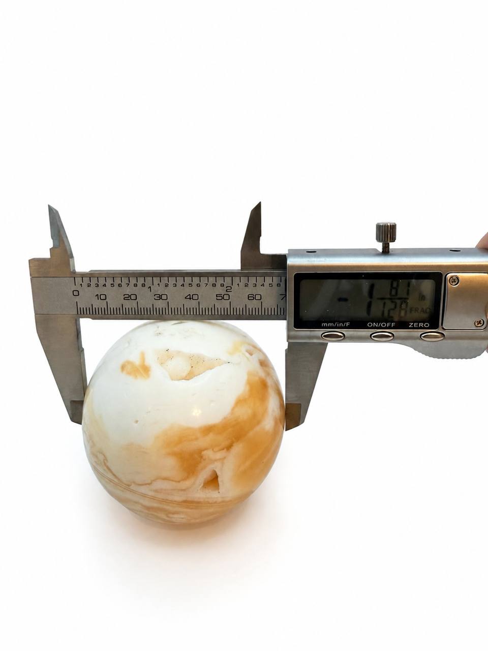 Honey calcite sphere 1.81 inch diameter measurement