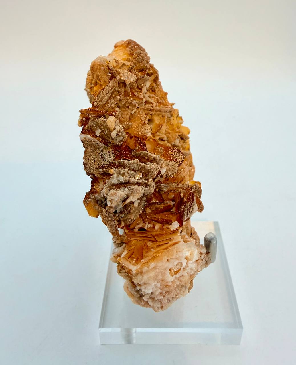 Vanadinite on barite vertical view on stand