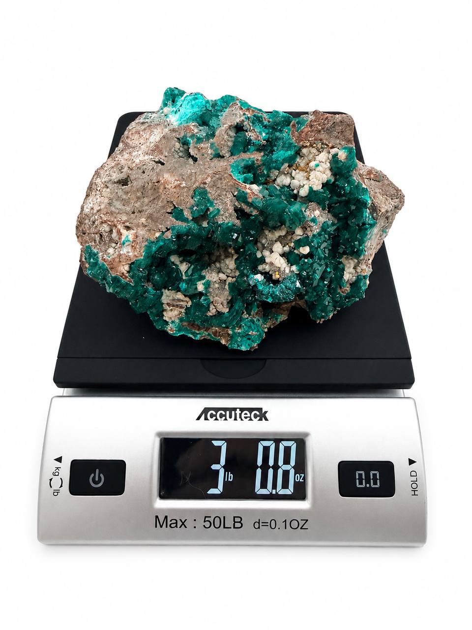 Dioptase specimen on scale showing 3 lbs 8 oz weight