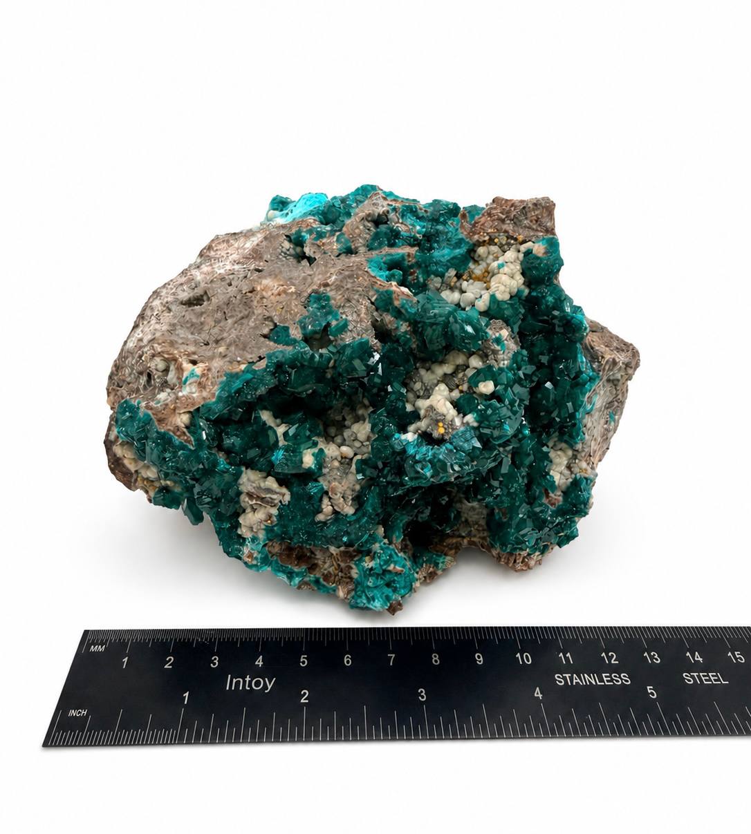 Dioptase specimen with ruler showing 5 inch width