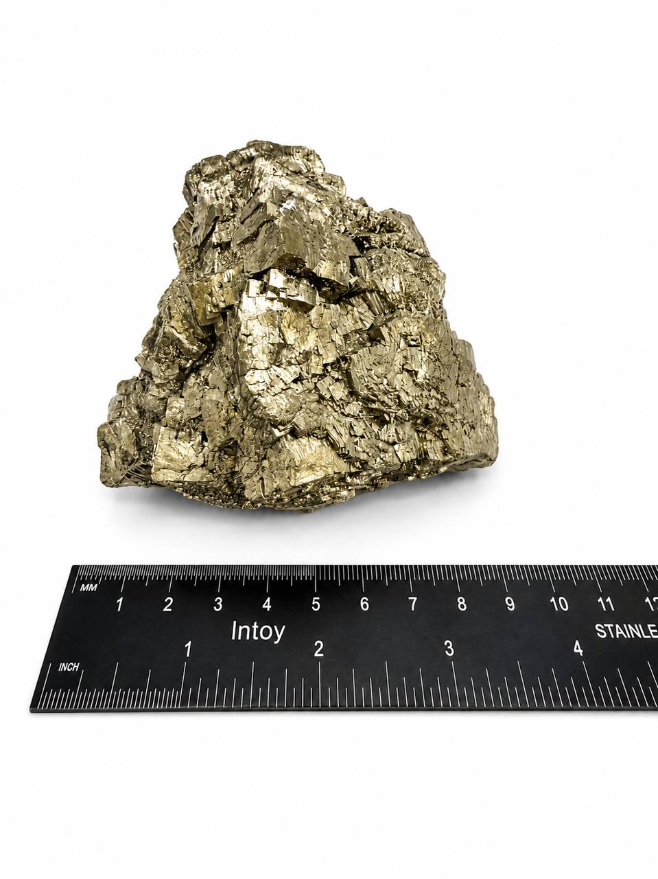 Pyrite cluster side view with ruler measurement