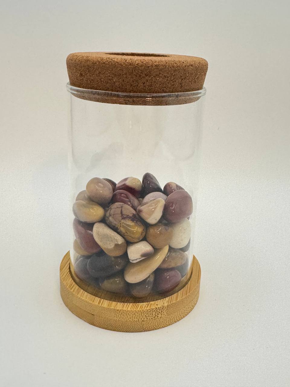 Mookaite jasper propagation station with glass vase, cork ring, and bamboo coaster