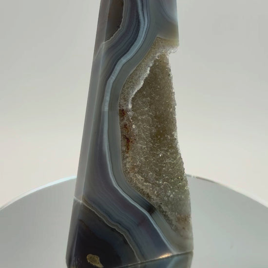 Blue banded agate obelisk with druzy quartz pocket