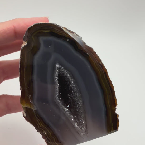 Banded agate geode turning in the light