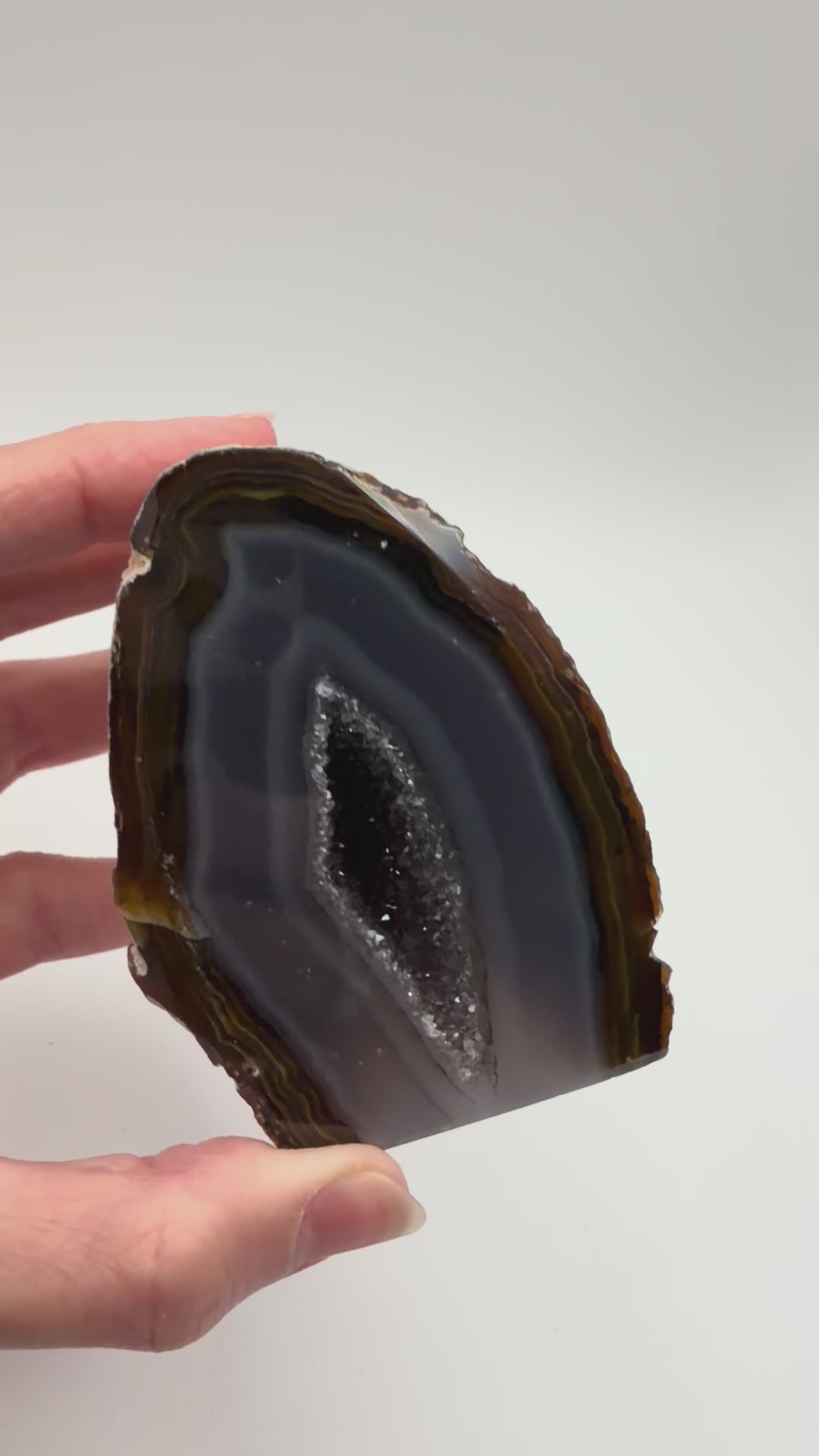 Banded agate geode turning in the light