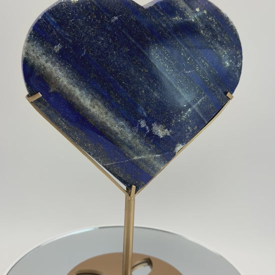 Lapis lazuli heart on gold stand, video