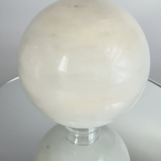 Milky quartz sphere, turning