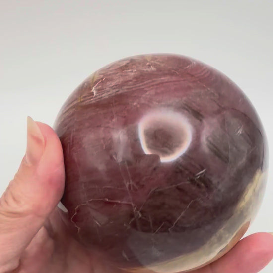 Petrified wood sphere, gold and red