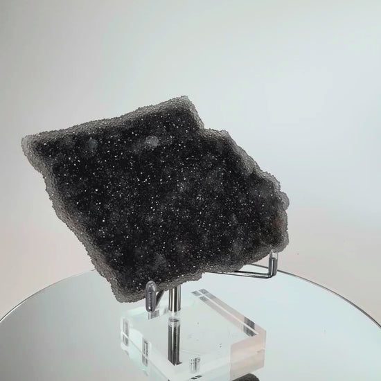 Amethyst druzy plate turning in the light